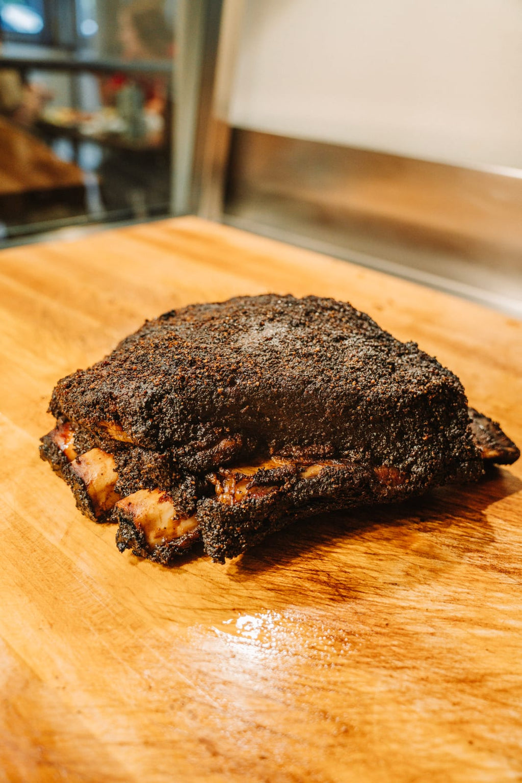 Three beef rib bones smoked together as one plate