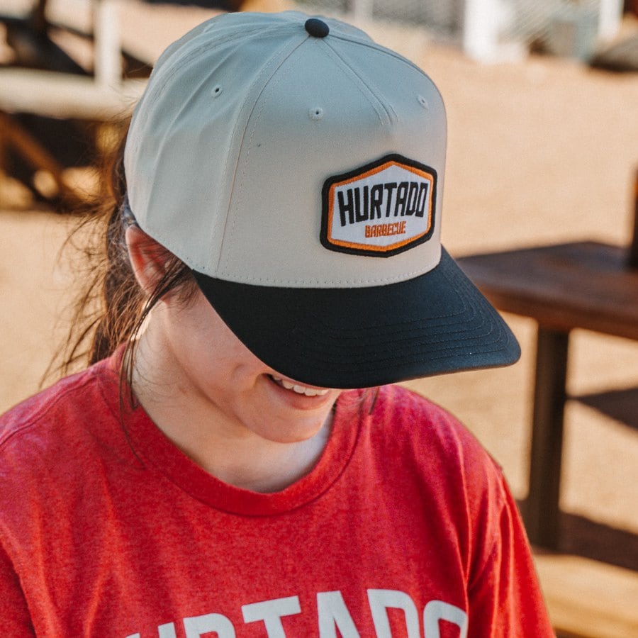 Hexagon Patch Cap in light grey with a black brim and the Hurtado Barbecue hexagon patch