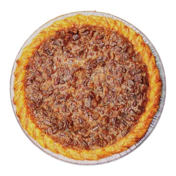 A whole pecan pie covered in pecan halves, seen from above